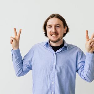 happy-satisfied-man-showing-v-sign-symbol-peace-with-fingers-looking-camera-with-toothy-smile-celebrating-his-successful-victory-isolated-white-background_231208-14079